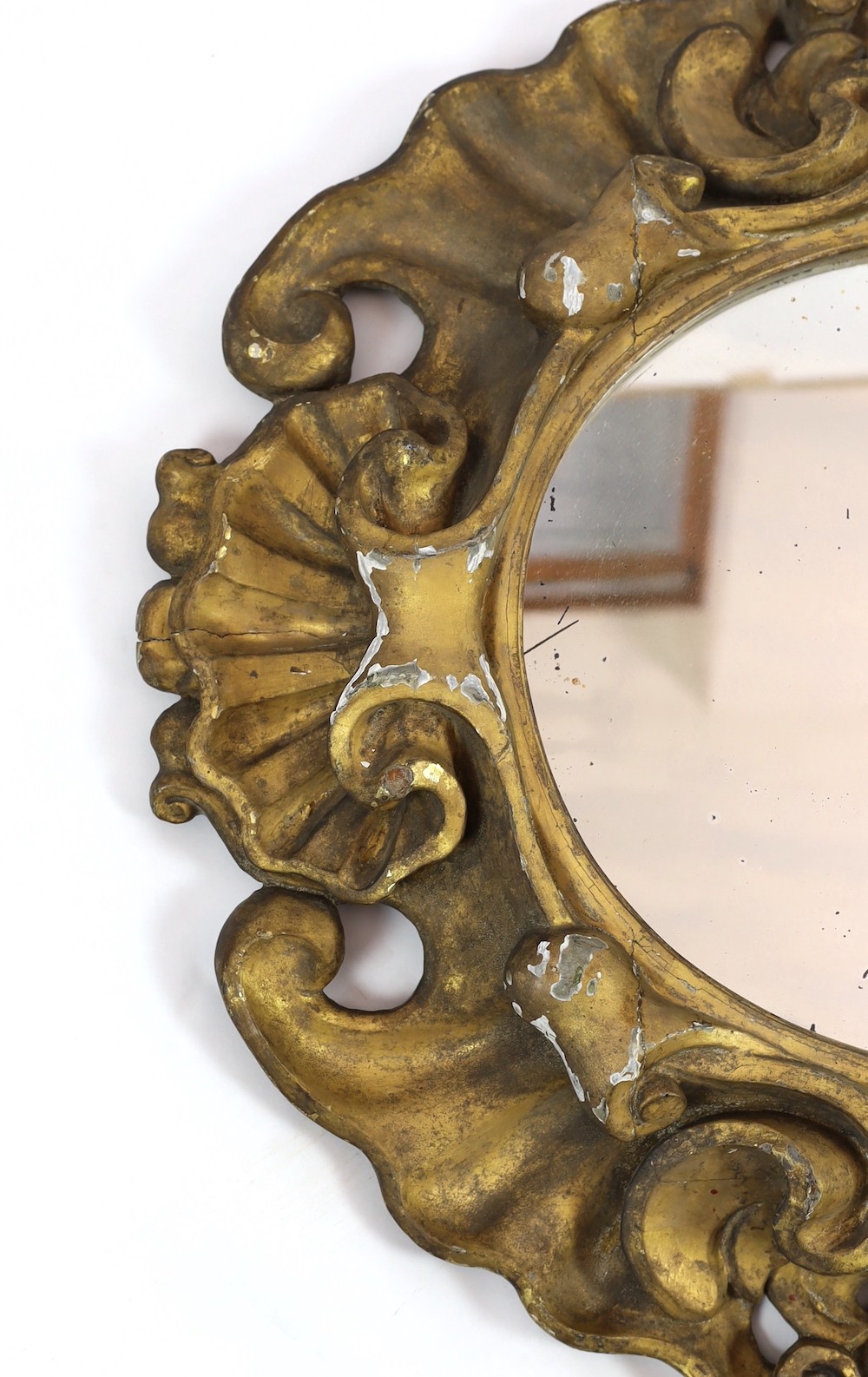 An 18th century Baroque giltwood wall mirror, width 95cm, height 84cm